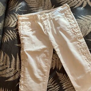 DKNY white skinny jeans with lace-up on both sides all the way to the top